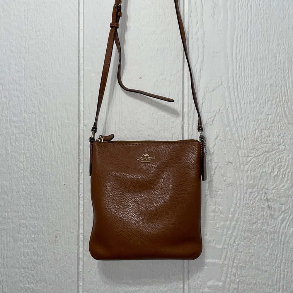 Brown Coach passenger cross body bag